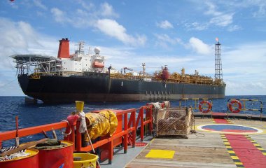 Floating production storage and offloading(FPSO) unit at work off the shore of Thailand clipart