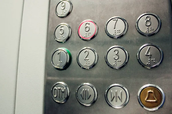 The elevator buttons in the business building