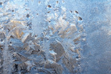 Pencere camındaki buz soyut arkaplan fotoğraf dokusunu kapatır