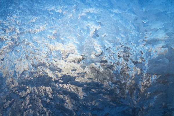 Frost on window glass close up abstract background photo texture Stock Image