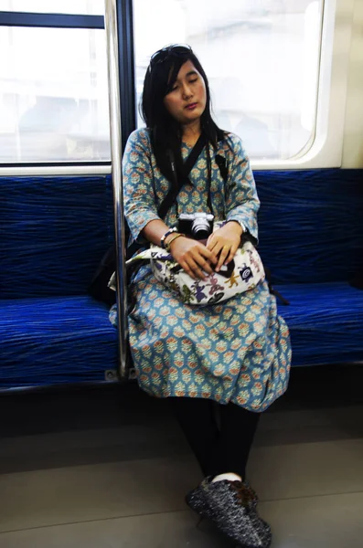 Traveler thai woman sitting on Express Electric Railway train fr — Stock Photo, Image