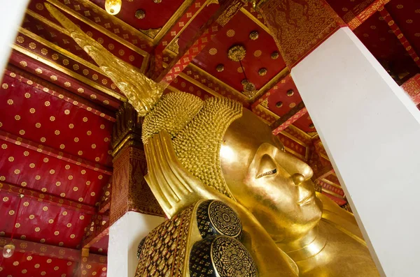 Big golden reclining buddha statue in ubosot or chapel at Wat Pa — Stock Photo, Image