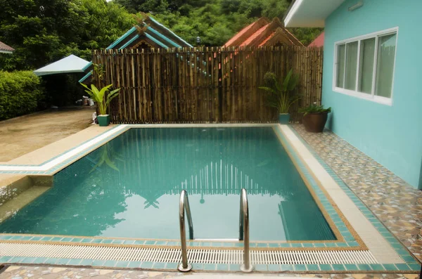 Small swimming pool at inside of local resort — Stock Photo, Image