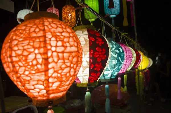 Hanging variety of colorful paper lamp and lantern lighting equi