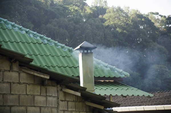 Smoke from chimney of local house in morning time at Doi Pui Tri — Stock Photo, Image