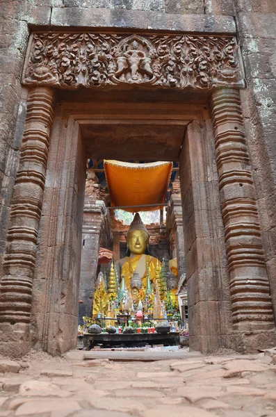 Imagem da estátua de Buda das ruínas no sítio arqueológico em Vat Phou ou — Fotografia de Stock