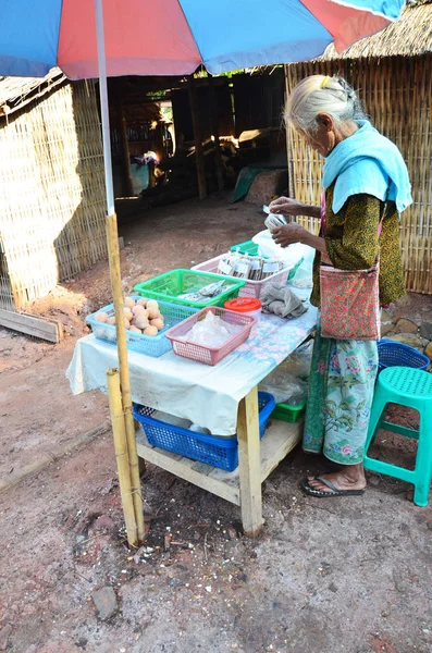 Asian thai old woman people sale food and salt from rock salt In — Stock Photo, Image