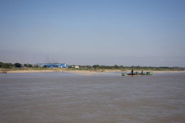 Laos people working sand suction dredger boat at riverside of me