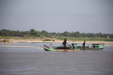 Laos people working sand suction dredger boat at riverside of me