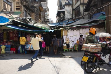 Thai people walking select and buying fabric material with acces