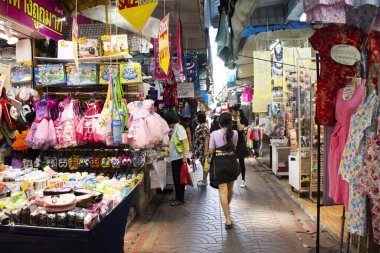 Thai people walking select and buying fabric material with acces
