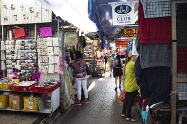 Thai people walking select and buying fabric material with acces