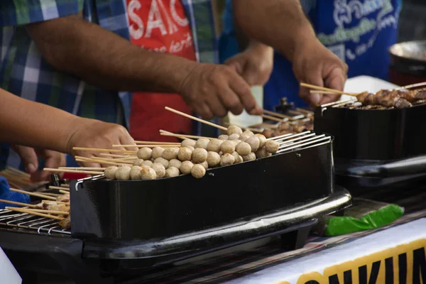 Meet ball and beef and pork and chicken roasted and grilled for sale thai people and travelers foreigner at street market in Nakhon Ratchasima, Thailand