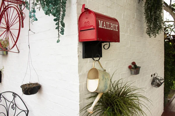 Red mailbox decoration furniture at terrace outdoor of cafe coffee shop at Narathiwat, Thailand