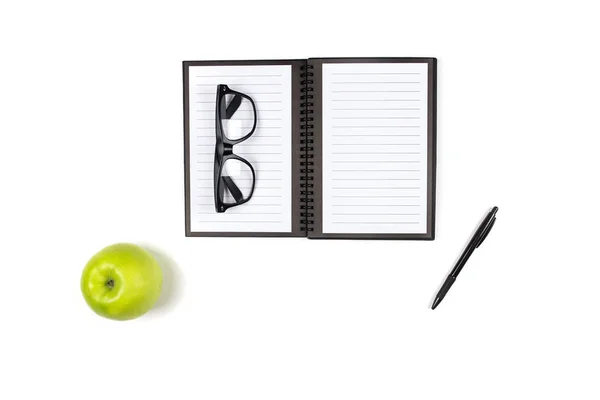 Flat lay, top view office table, notebook, glasses, pen and appl — Stock Photo, Image