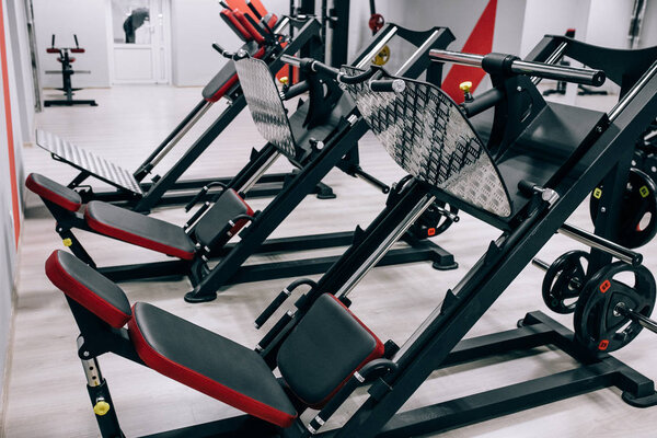 Weight lifting equipments in a club gym.