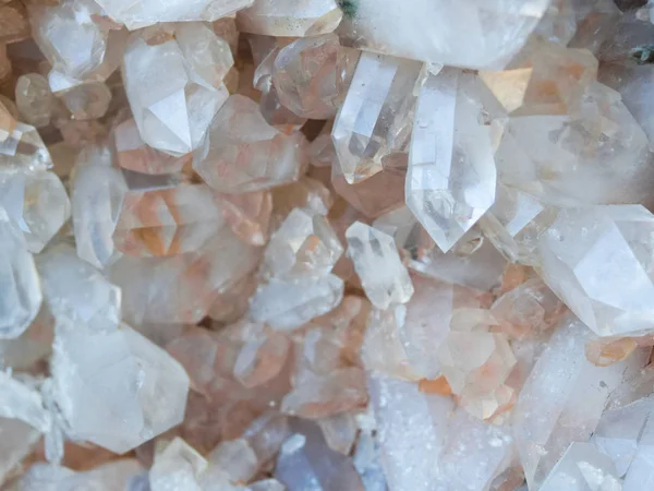 Background, smoky quartz crystals cluster close-up, in the rock. The most common mineral