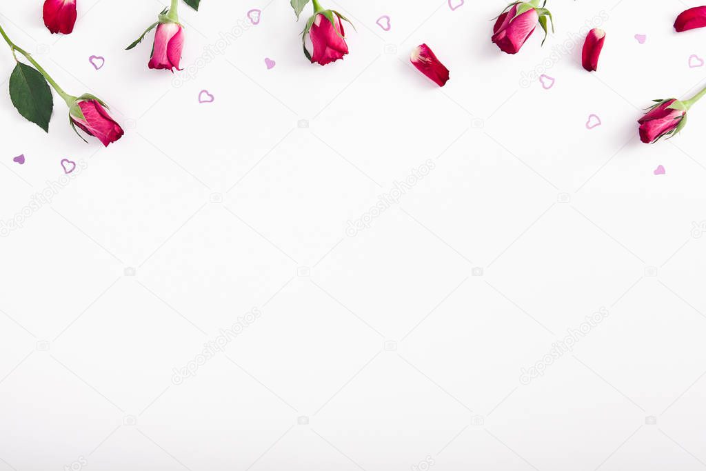 Floral border with blank space. Frame of pink roses and petals