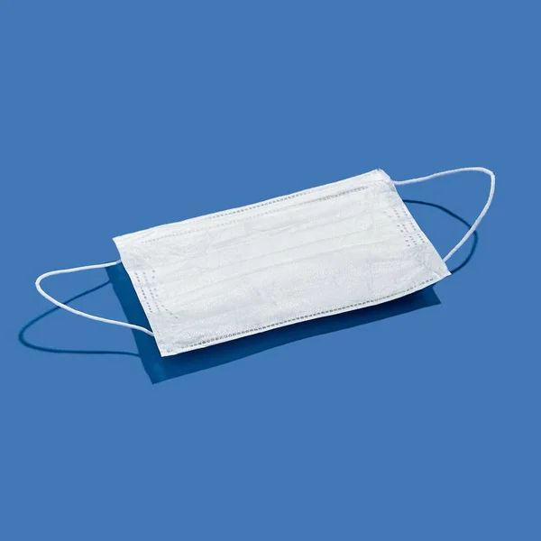 Surgical Face Mask Blue Background Shadow Minimal Medical Concept — Stock Photo, Image