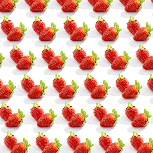 Creative trendy pattern with fresh strawberry on white. Organic healthy food concept