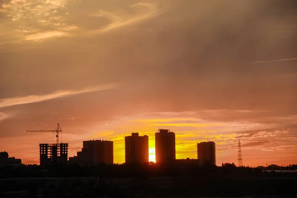 landscape of urban buildings in the background at sunset