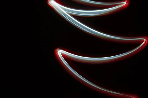 multicolored light lines on a black background