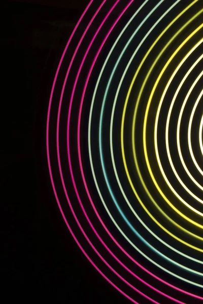Multicolor light circles on a black background