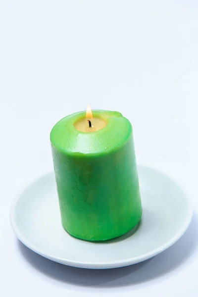 Green Burning Candle Saucer — Stock Photo, Image