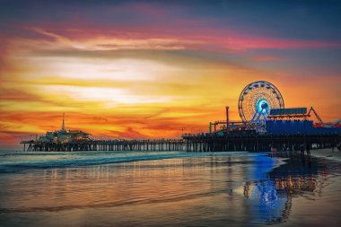 The Santa Monica Pier at sunset clipart