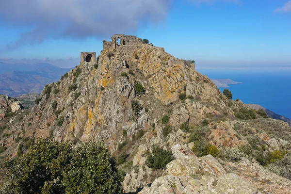 Spain castle ruins at top of steep rocky spur