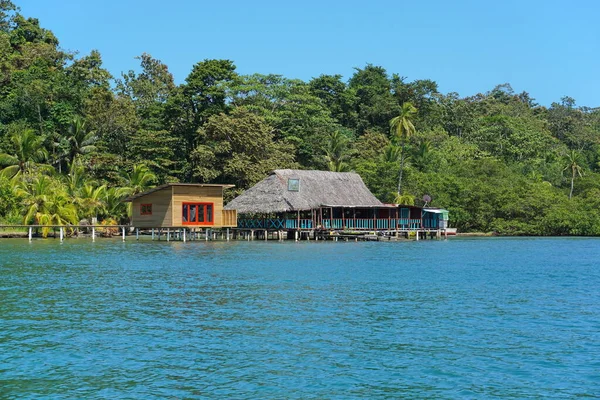 Tropical restaurant and cabin over water in Panama
