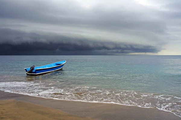 Beach and storm with threatening clouds