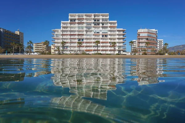 Beach with apartment building Spain Costa Brava