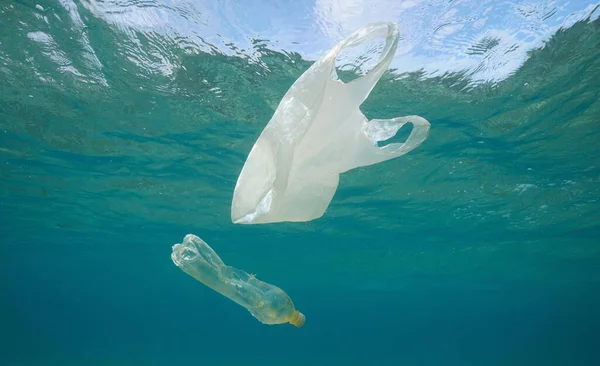 Underwater pollution plastic bag and bottle in sea