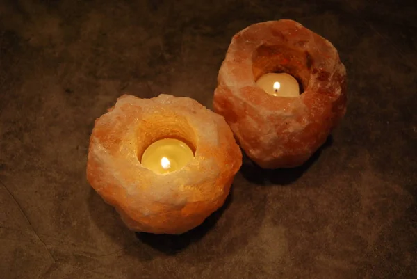 Two Himalayan Salt Lamp Candles Diagonally Dark Setting — Stock Photo, Image