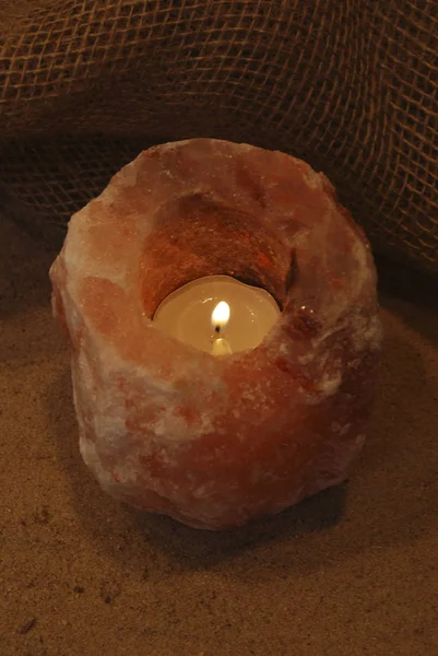 Himalayan Salt Lamp Candle Lit Natural Background — Stock Photo, Image