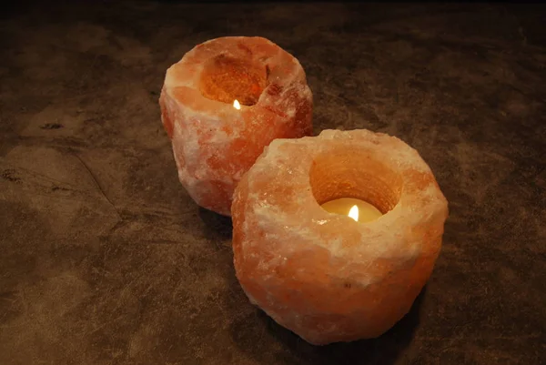 Two Himalayan Salt Lamp Candles Lit Set Diagonally Stock Picture