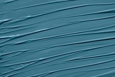 Blue stone trendy color of the year 2020. Abstract art background with brush strokes. Monochrome color texture.