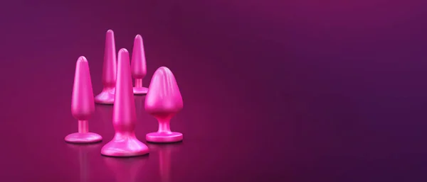 Dildo, vibratör ve kalça tıkaçları da dahil olmak üzere farklı seks oyuncakları koleksiyonu.