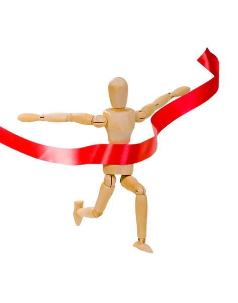 Figura de madeira de um homem executando um vencedor líder em um fundo branco com fita vermelha — Fotografia de Stock