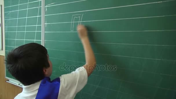 Odessa, Ukraine - 30 May 2014: school children write on the blackboard, celebrating the day of graduation. Last school bel — Stock Video