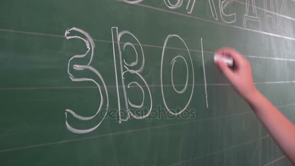 Odessa, Ukraine - 30 May 2014: school children write on the blackboard, celebrating the day of graduation. Last school bel — Stock Video