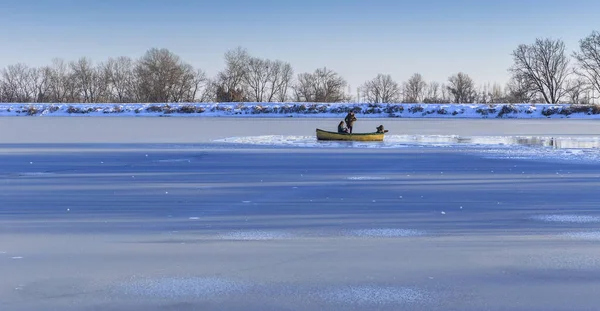 Young couple and photographer in a boat on a frozen lake Nohur.G — Stock Photo, Image