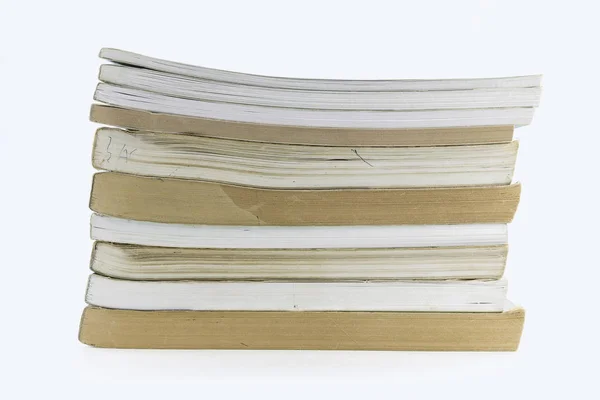 A stack of books lying on a white background — Stock Photo, Image