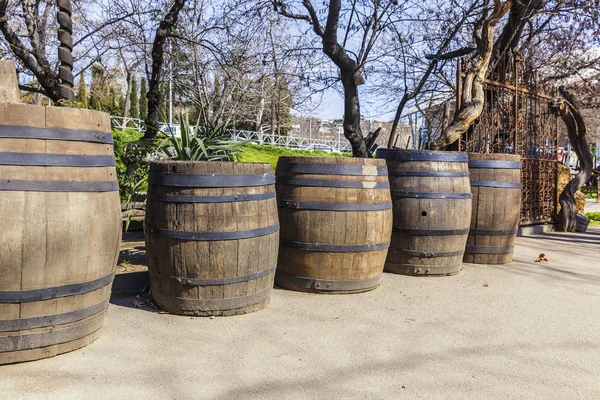 Old oak barrels standing on the street