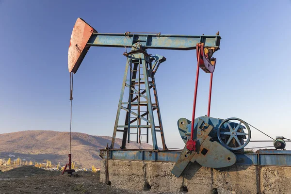 Oil rocking standing in the mountains — Stock Photo, Image