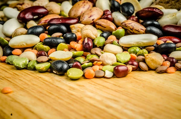 Legumes on wood, closeup, backgroun — Stock Photo, Image