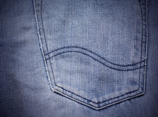 Texture of blue jeans back pocket textile