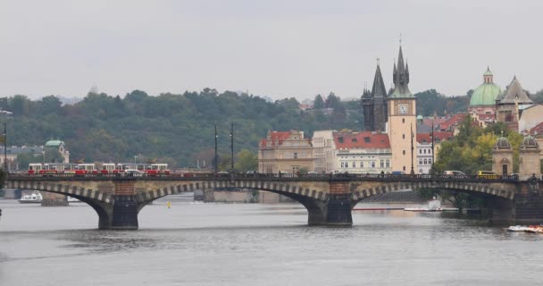 Red tram on Legion Bridge in Prague — Stock video