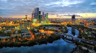 Moscow City district and Moscow river at dusk clipart